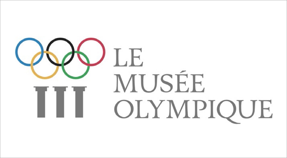 Logo du musée olympique de Lausanne avec les cinq anneaux olympiques, bleu, noir, rouge, jaune et vert.